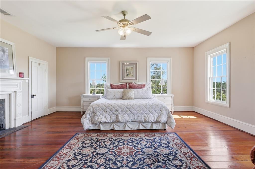 8075 Lakeview Road Statesboro, GA 30461 - Photo 33 of 46 a bedroom with a large bed and a window