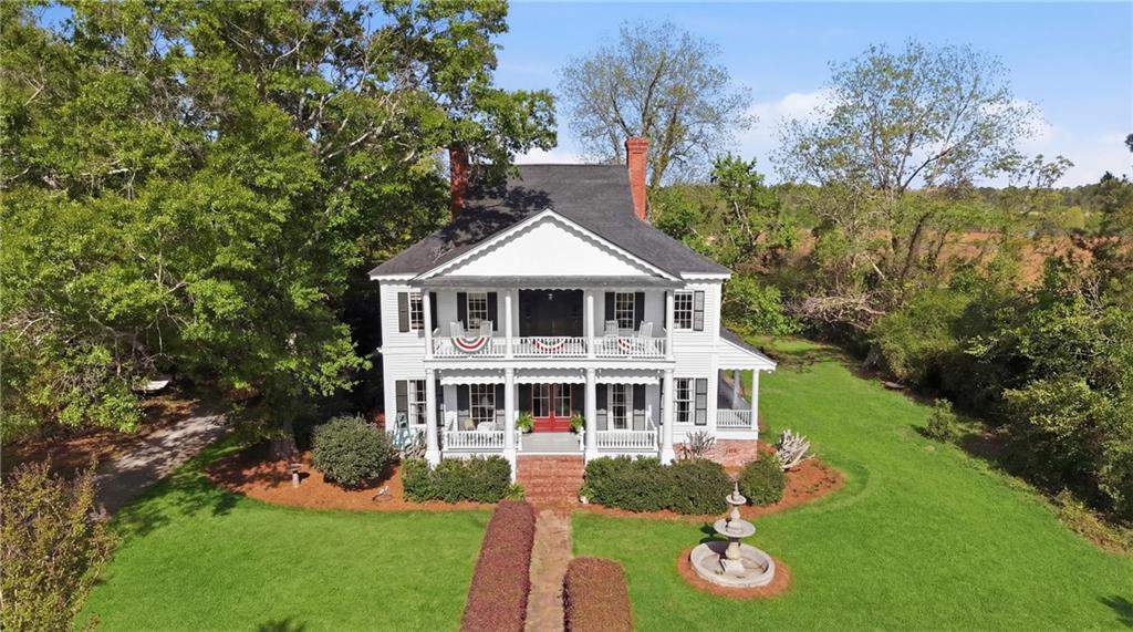 8075 Lakeview Road Statesboro, GA 30461 - Photo 43 of 46 a aerial view of a house with a yard table and chairs