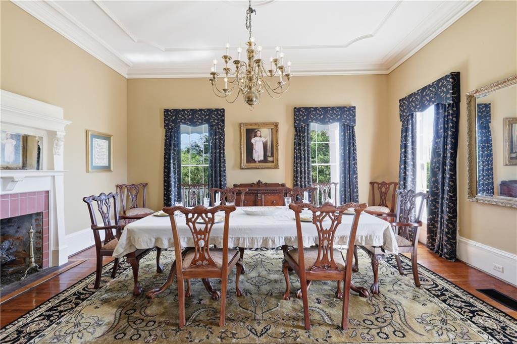 8075 Lakeview Road Statesboro, GA 30461 - Photo 7 of 46 a view of a dining room with furniture window and wooden floor