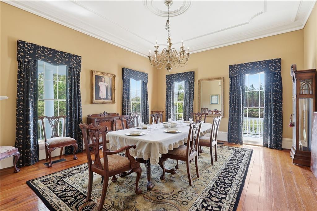 8075 Lakeview Road Statesboro, GA 30461 - Photo 8 of 46 a view of a dining room with furniture window and wooden floor