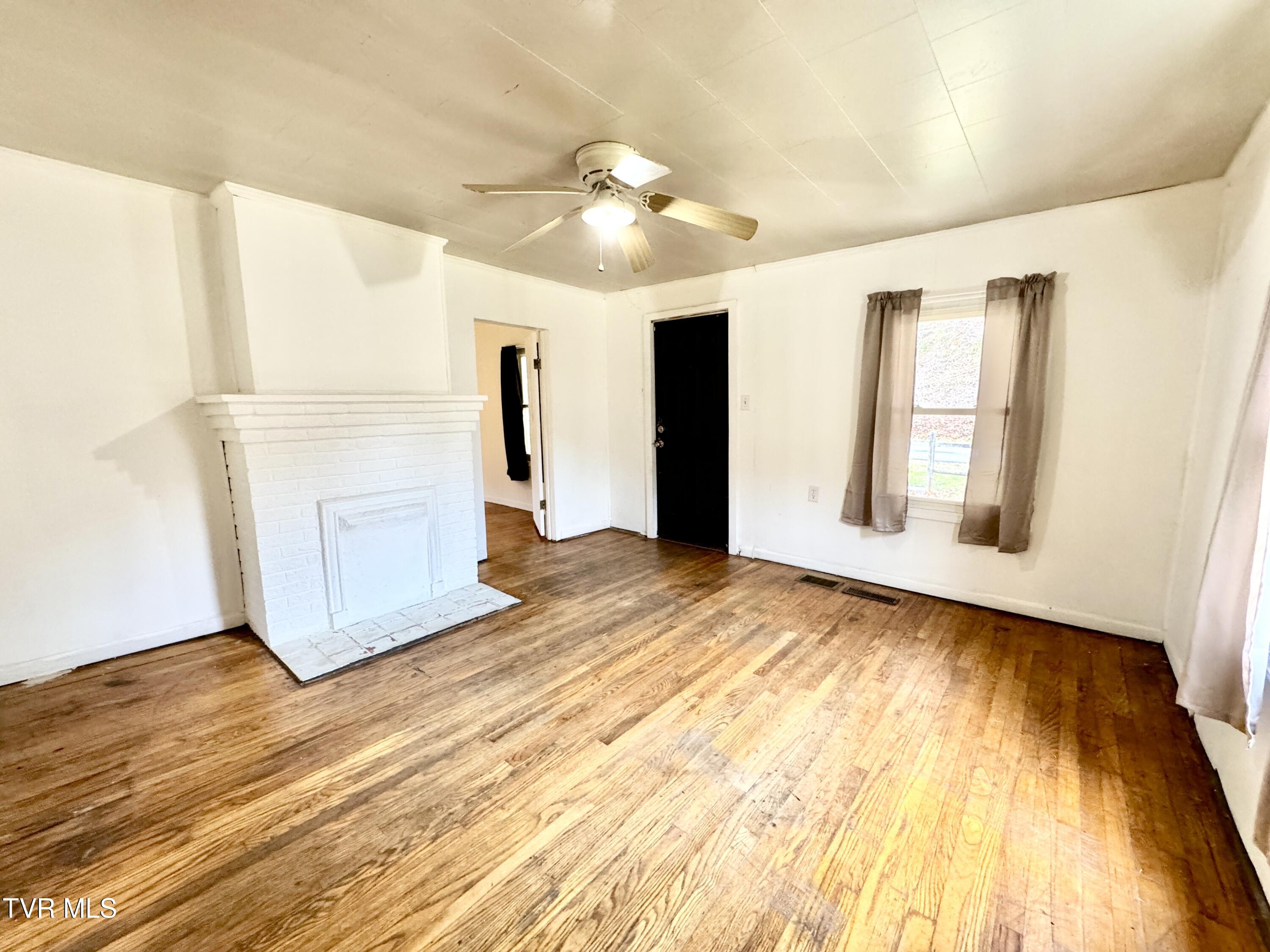 2342 Roda Road Appalachia, VA 24216 - Photo 30 of 30 EMPTY LIVING ROOM TOWARD ENTRANCE