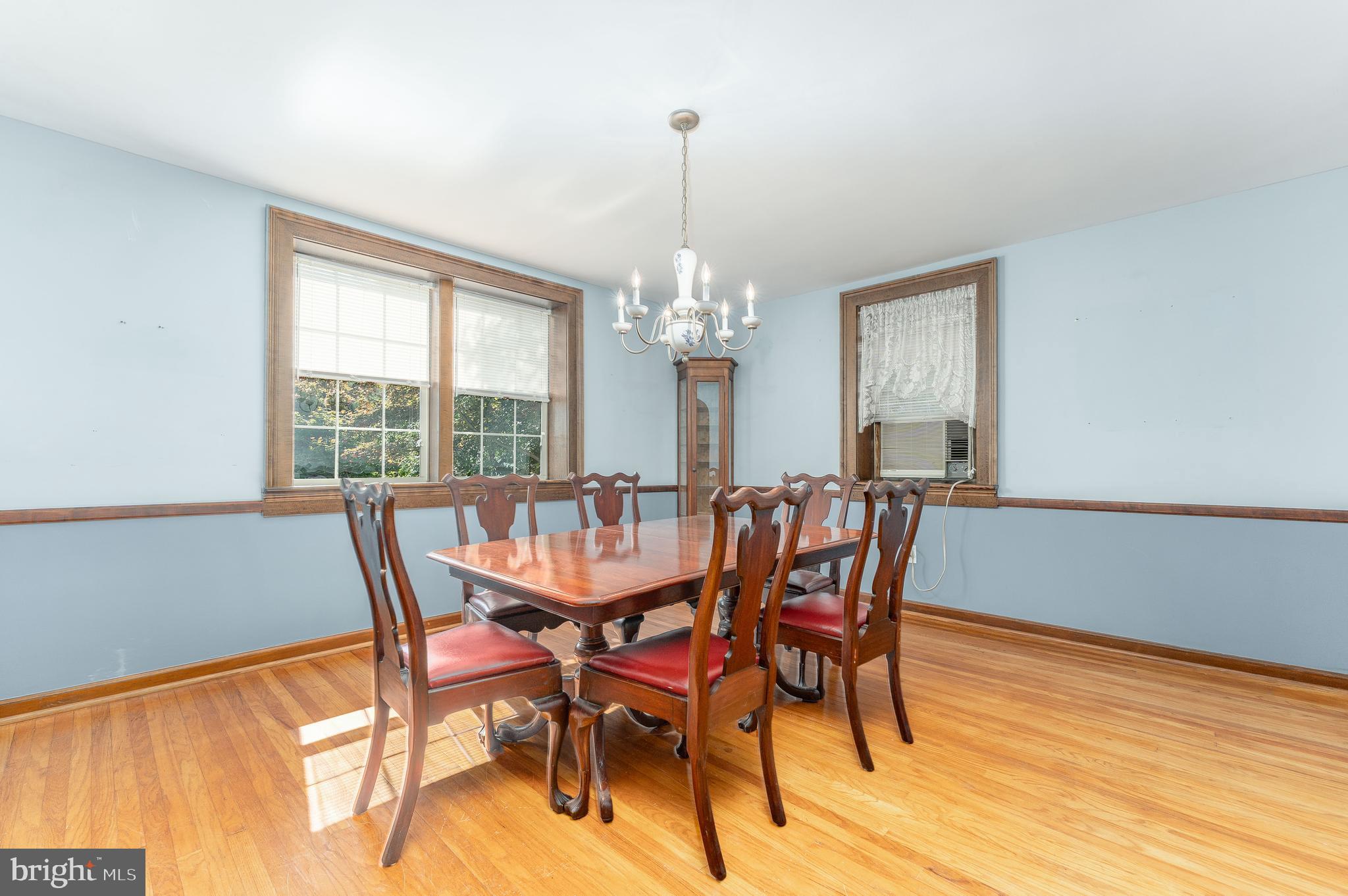 281 West Avenue Springfield, PA 19064 - Photo 11 of 51 a dining room with furniture a chandelier and wooden floor