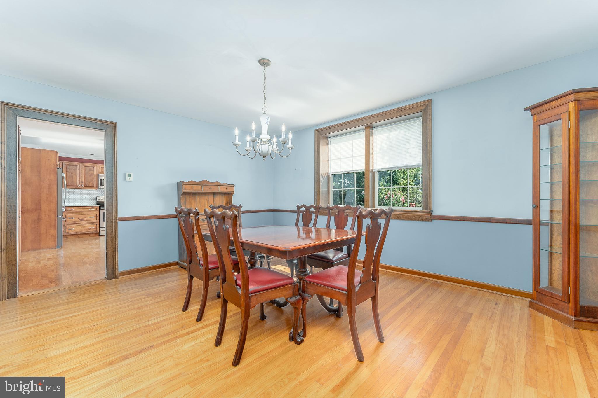 281 West Avenue Springfield, PA 19064 - Photo 12 of 51 a dining room with furniture a chandelier and wooden floor