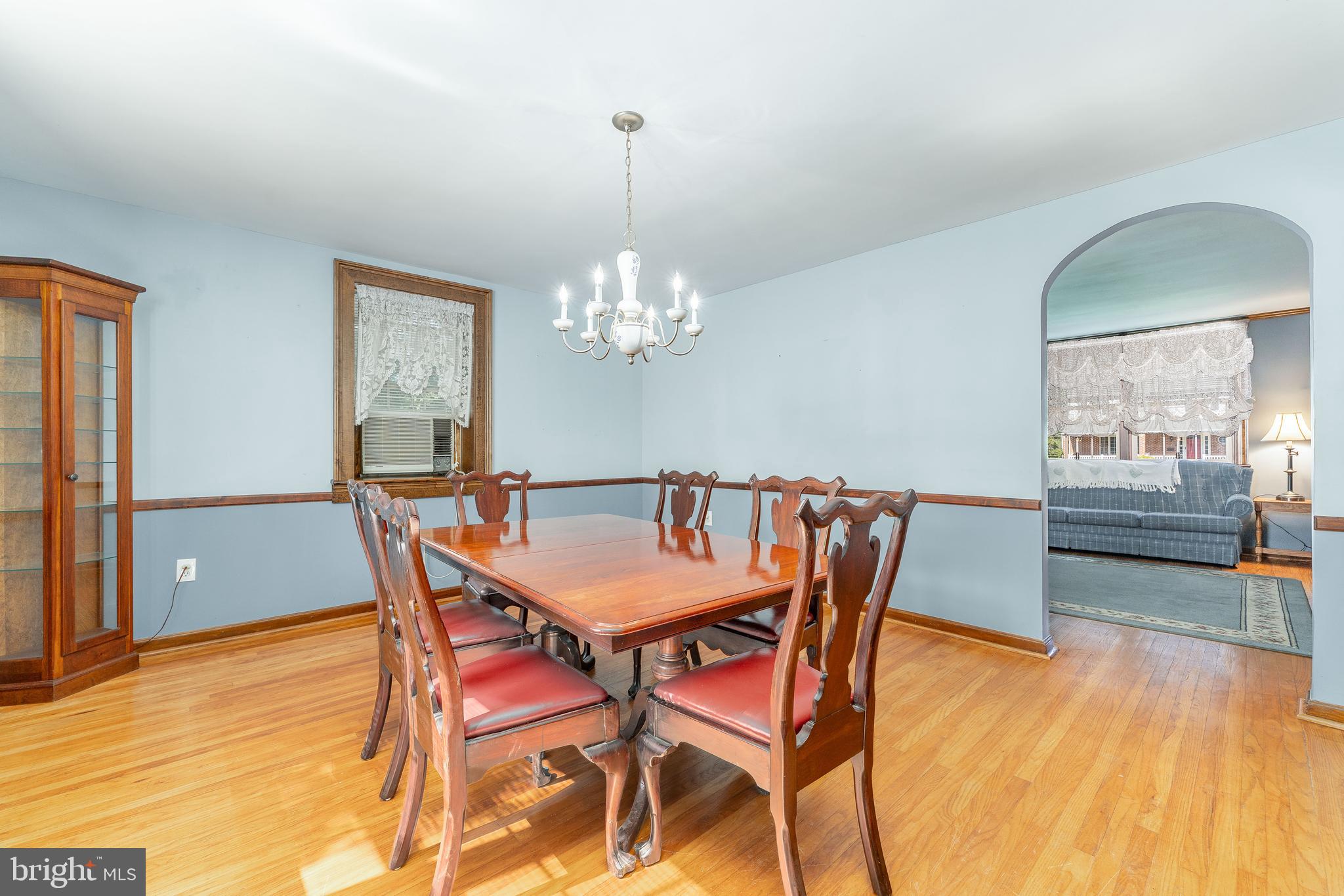 281 West Avenue Springfield, PA 19064 - Photo 13 of 51 a dining room with furniture a chandelier and wooden floor