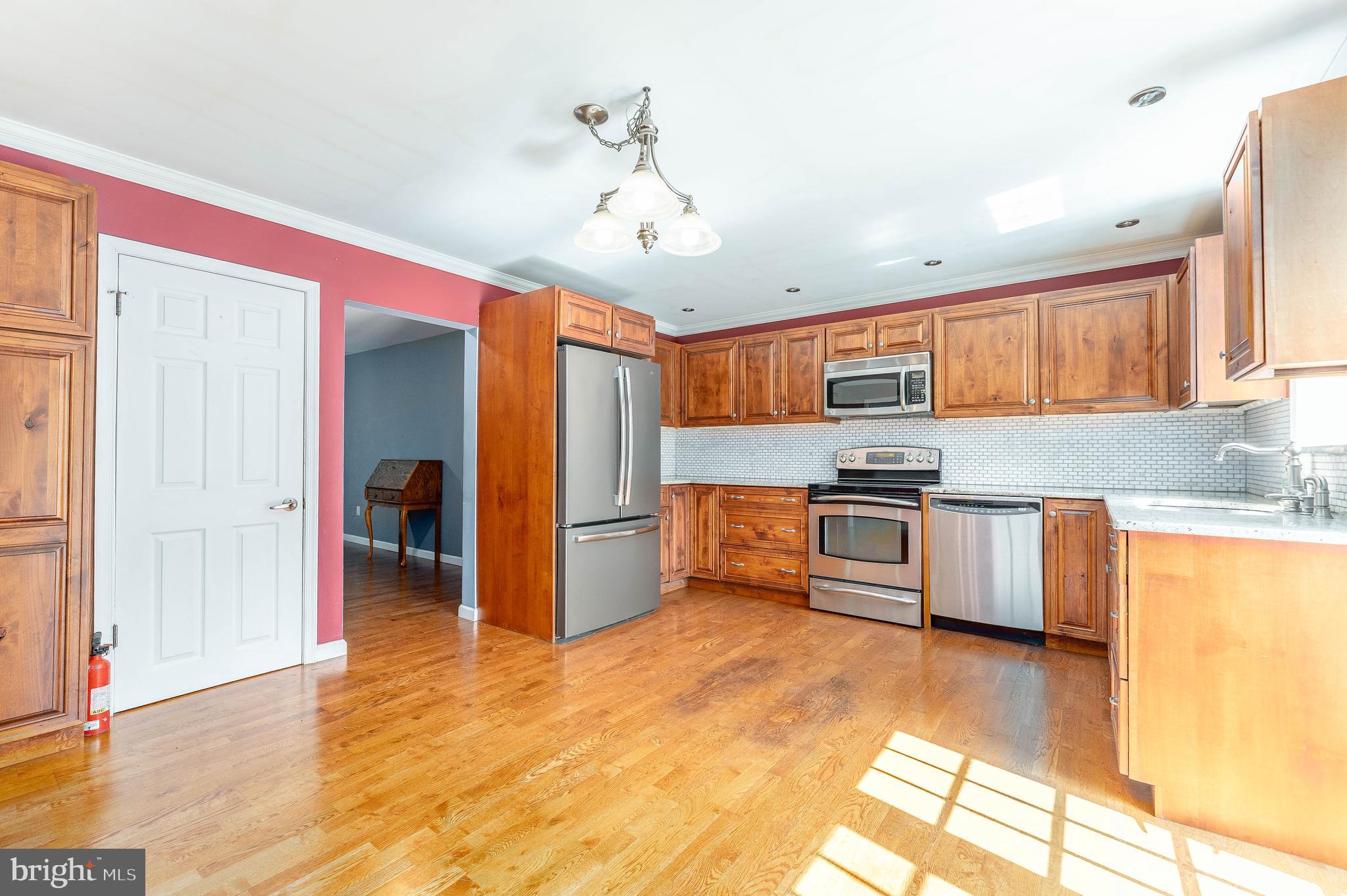 281 West Avenue Springfield, PA 19064 - Photo 15 of 51 a kitchen with stainless steel appliances granite countertop a refrigerator and a stove top oven