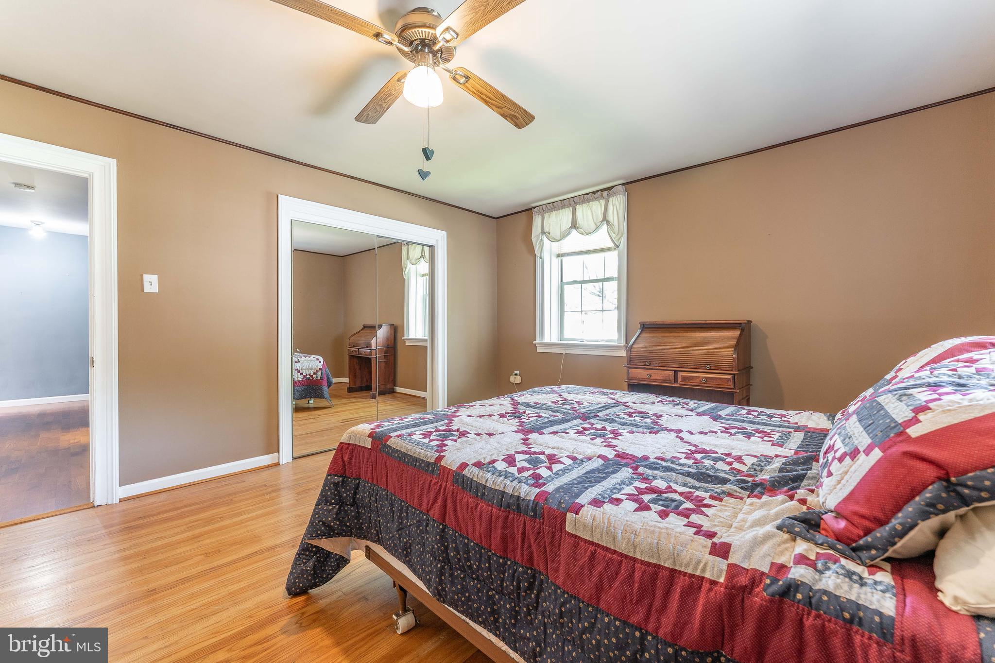 281 West Avenue Springfield, PA 19064 - Photo 30 of 51 a bedroom with a bed and a chandelier