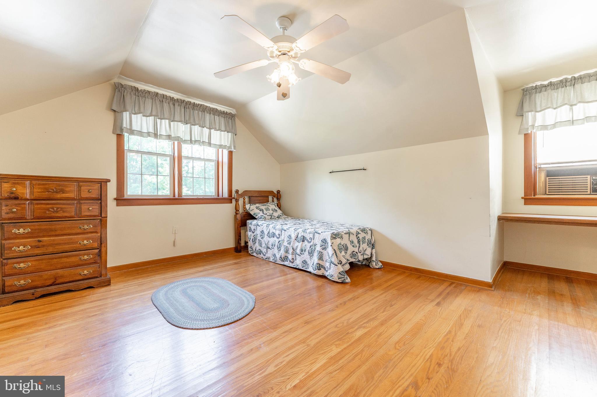 281 West Avenue Springfield, PA 19064 - Photo 33 of 51 an empty room with wooden floor and windows