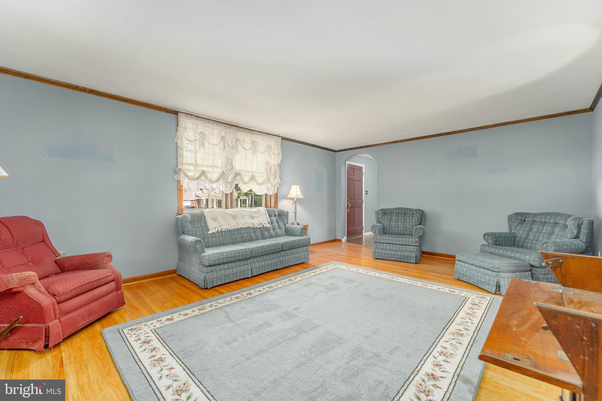 281 West Avenue Springfield, PA 19064 - Photo 9 of 51 a living room with furniture a rug and a wooden floor