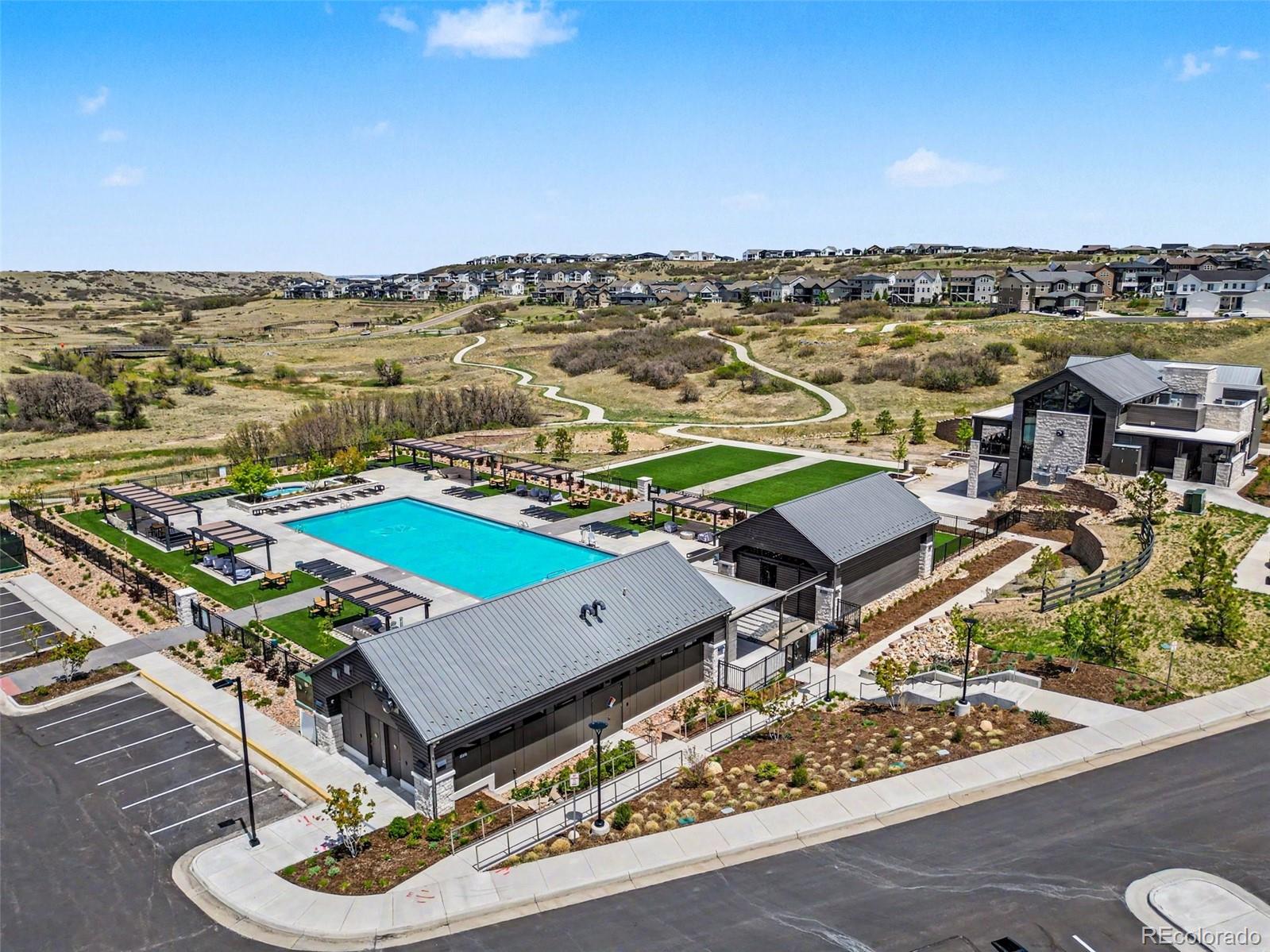 2101 Rim Ridge Drive Castle Pines, CO 80108 - Photo 45 of 50 an aerial view of a residential building with swimming pool and ocean view