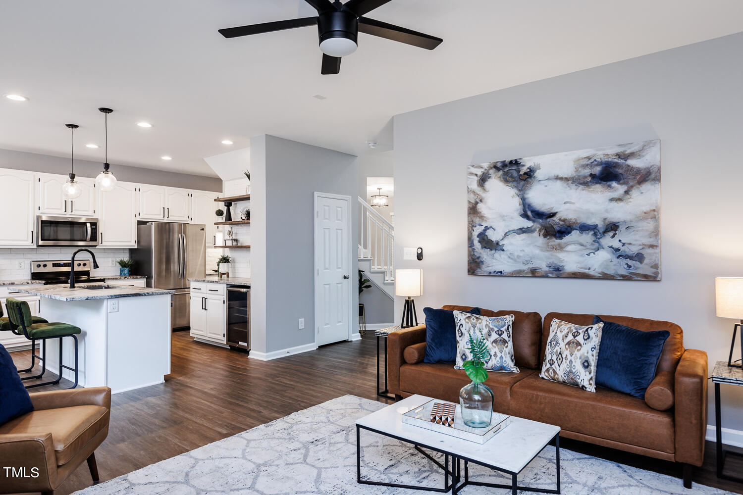 5120 Fairmead Circle Raleigh, NC 27613 - Photo 12 of 49 a living room with stainless steel appliances kitchen island a table and a couch