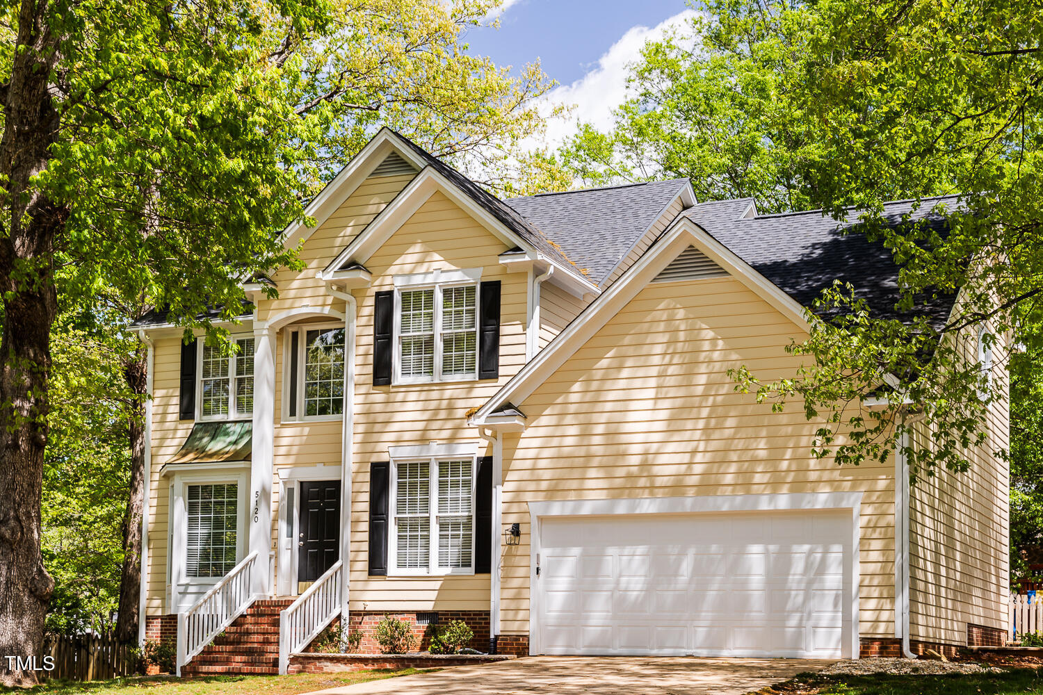 5120 Fairmead Circle Raleigh, NC 27613 - Photo 40 of 49 a view of a white house with large windows