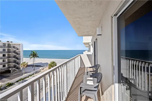 a view of balcony with furniture