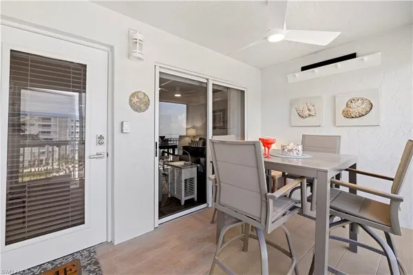 a view of a dining table and chairs in a room
