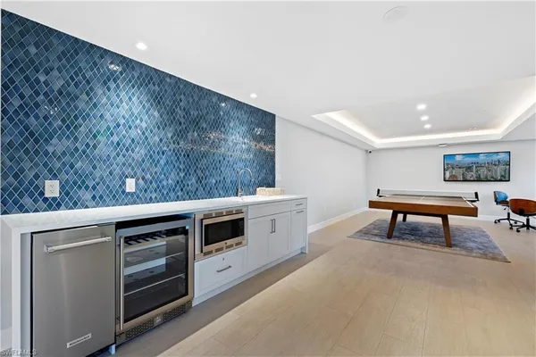 a room with furniture and a potted plant