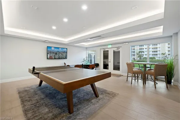 a room with furniture a table and painting on the wall