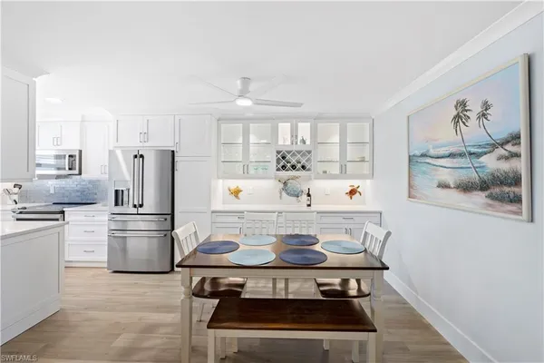 a kitchen with a stove and a refrigerator
