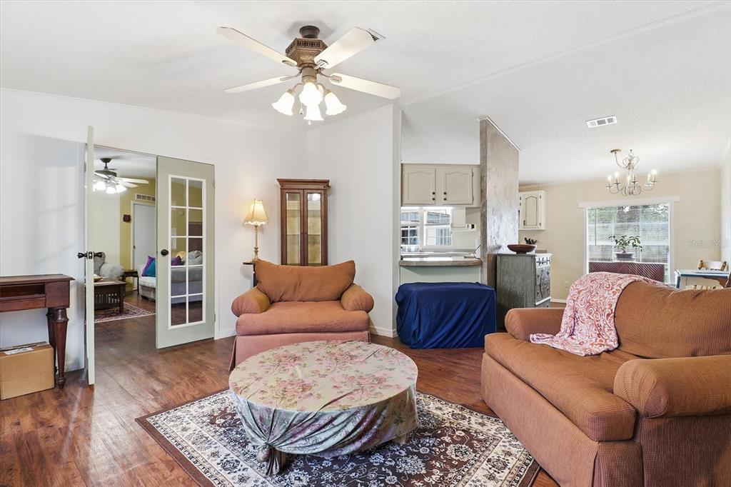 4950 West Mockingbird Street Homosassa, FL 34446 - Photo 15 of 47 a living room with furniture and a wooden floor