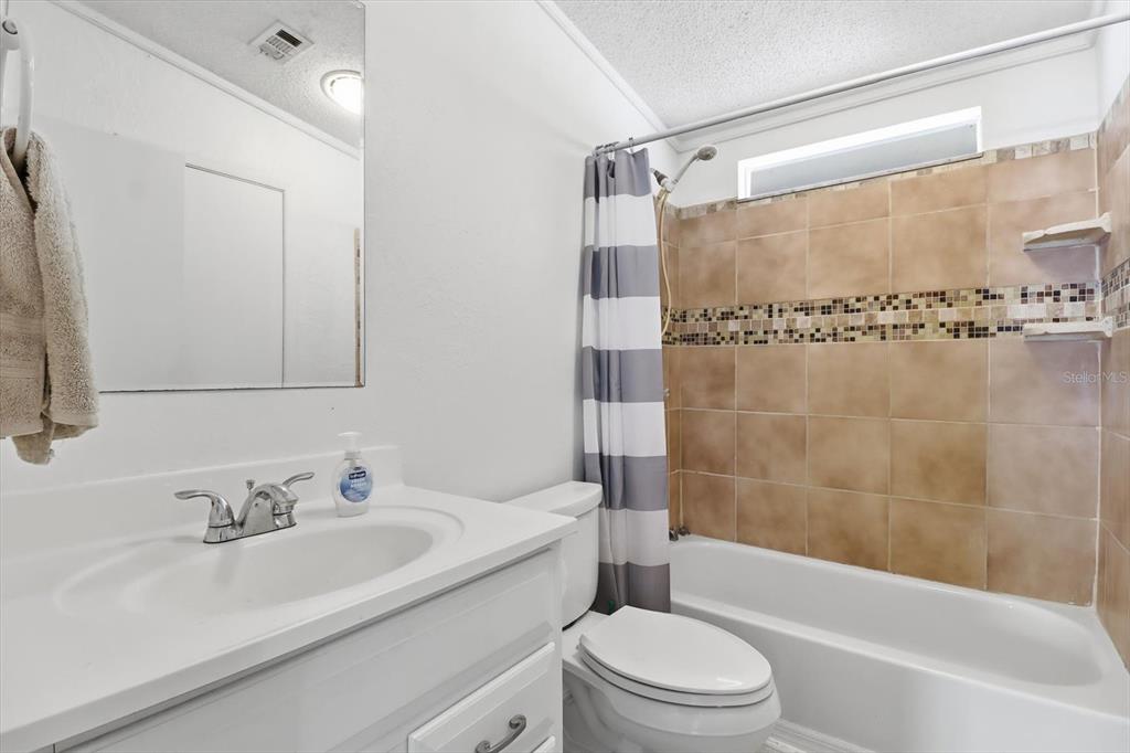 4950 West Mockingbird Street Homosassa, FL 34446 - Photo 21 of 47 a bathroom with a sink a toilet and a bathtub