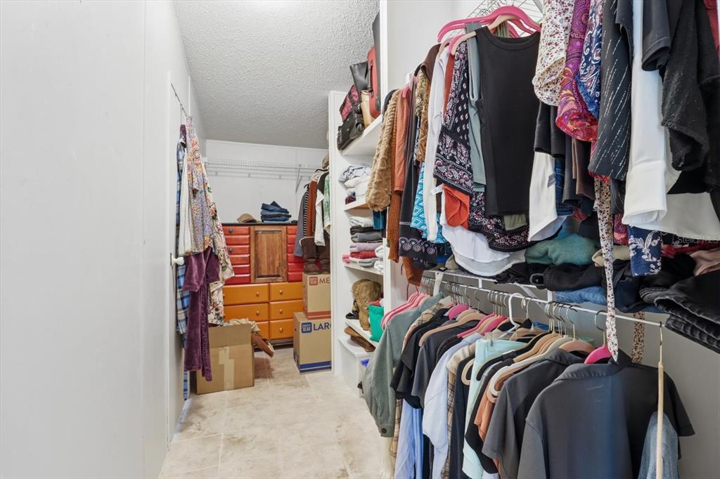 4950 West Mockingbird Street Homosassa, FL 34446 - Photo 25 of 47 a view of walk in closet with clothes and shoes