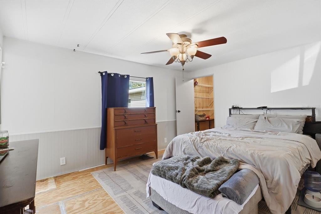 4950 West Mockingbird Street Homosassa, FL 34446 - Photo 29 of 47 a bedroom with a bed and wooden floor