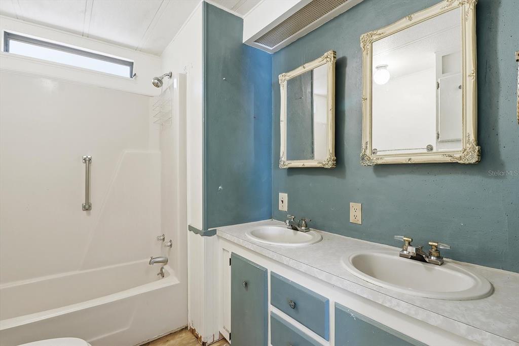 4950 West Mockingbird Street Homosassa, FL 34446 - Photo 32 of 47 a bathroom with a sink and a mirror