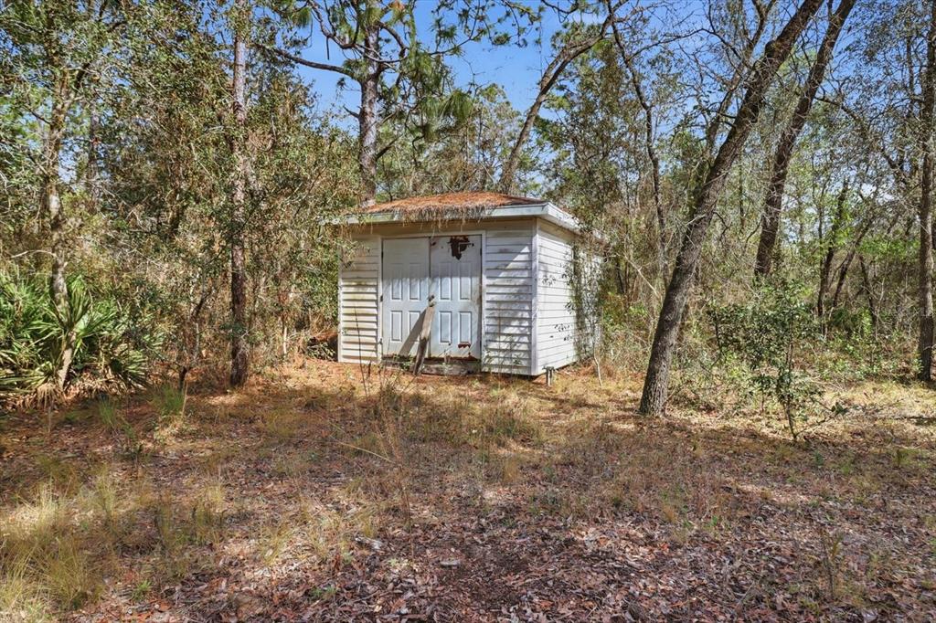 4950 West Mockingbird Street Homosassa, FL 34446 - Photo 46 of 47 a view of a house with a trees