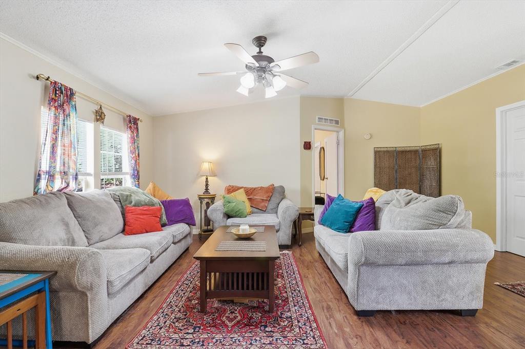 4950 West Mockingbird Street Homosassa, FL 34446 - Photo 5 of 47 a living room with furniture and a large window