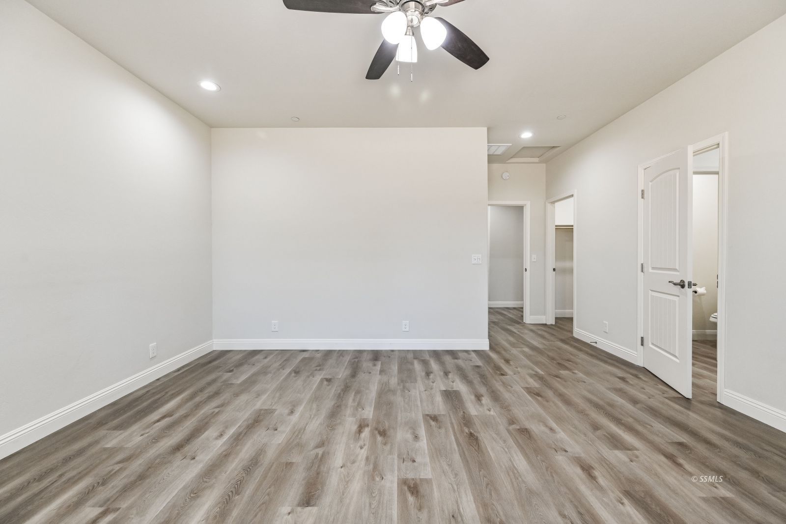 1031 West Church Avenue Ridgecrest, CA 93555 - Photo 26 of 49 a view of an empty room with wooden floor