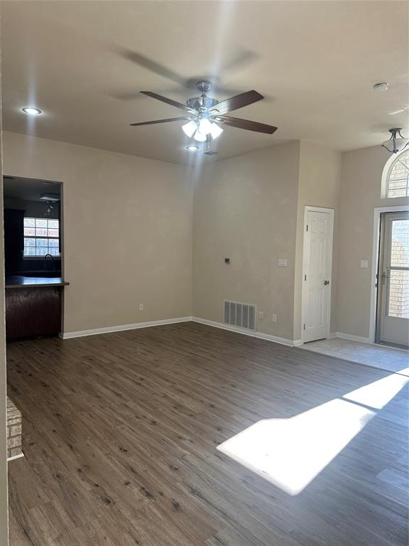 208 Pearl Drive Hewitt, TX 76643 - Photo 2 of 17 Unfurnished living room featuring dark wood finished floors and ceiling fan