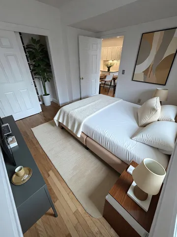 a bedroom with bed and window