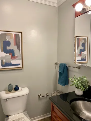 a bathroom with a toilet and a sink