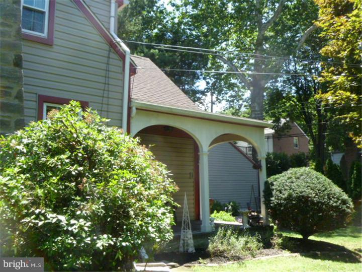 100 East Springfield Road Springfield, PA 19064 - Photo 14 of 21 a front view of a house with garden