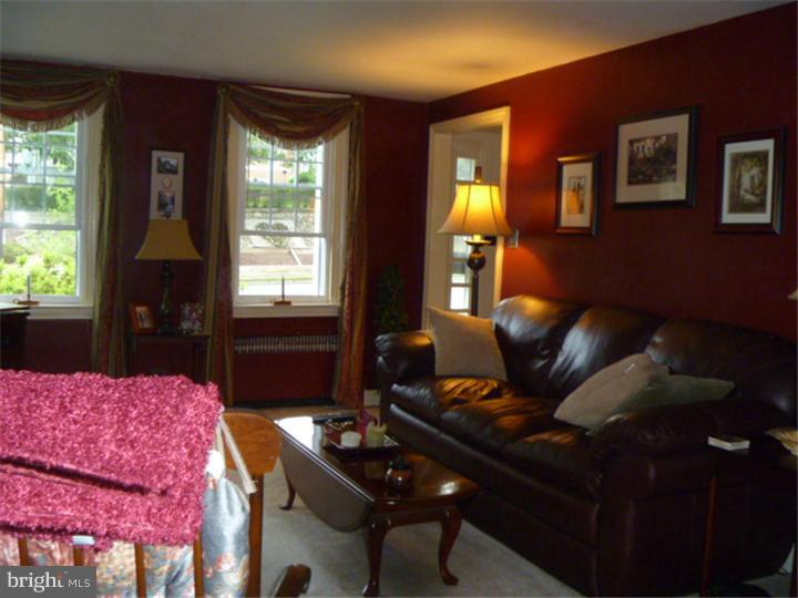 100 East Springfield Road Springfield, PA 19064 - Photo 6 of 21 a living room with furniture and a window