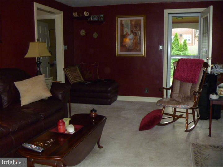 100 East Springfield Road Springfield, PA 19064 - Photo 7 of 21 a living room with furniture rug and a window