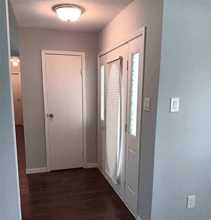 911 Redcedar Way Drive Coppell, TX 75019 - Photo 2 of 10 a view of a hallway with wooden floor