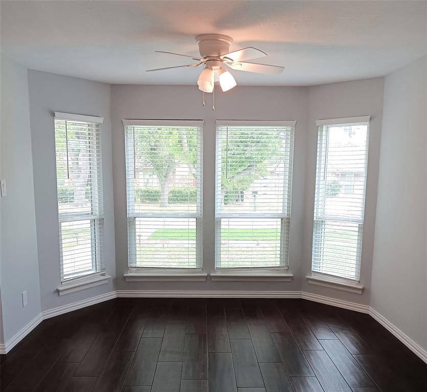 911 Redcedar Way Drive Coppell, TX 75019 - Photo 3 of 10 a view of an empty room with wooden floor and a window