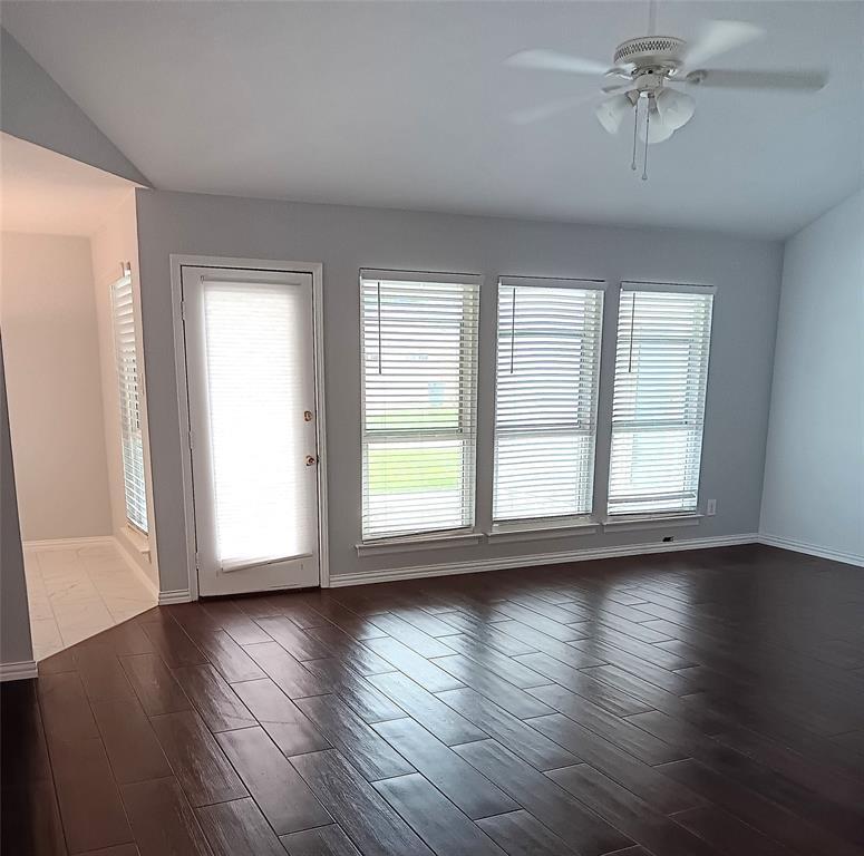 911 Redcedar Way Drive Coppell, TX 75019 - Photo 5 of 10 a view of an empty room with wooden floor and a window