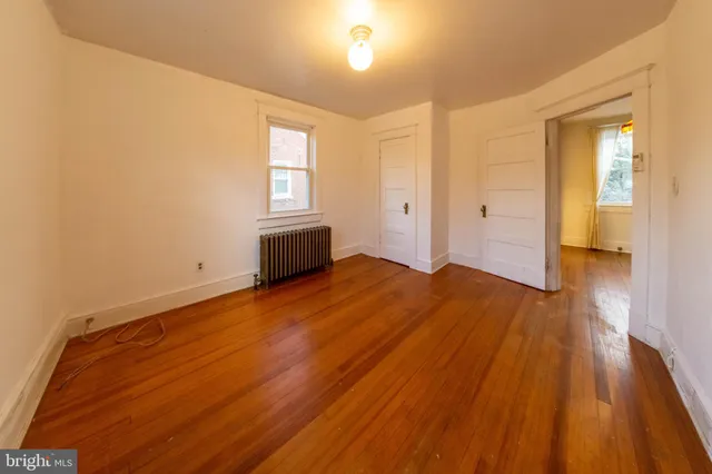 a bathroom with a granite countertop toilet a sink and a bathtub