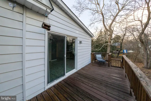 a view of a house with a yard chairs and table
