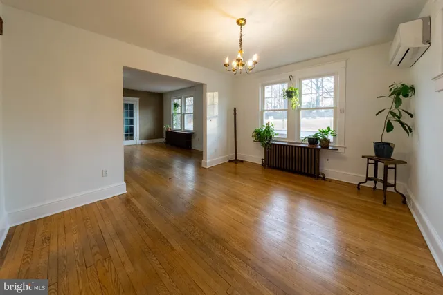 a view of a livingroom with furniture window and wooden floor
