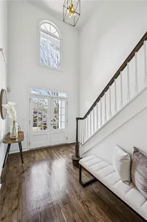 a living room with furniture a fireplace and a table