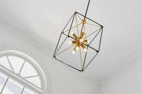 a living room with furniture a window and a fireplace