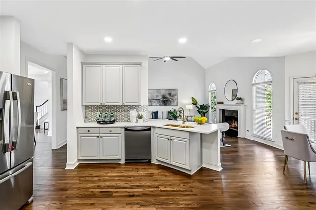 a view of a dining room with furniture and a potted plant