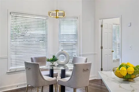 a bathroom with a double vanity sink a mirror and a shower