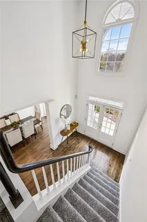 a white bath tub sitting next to a shower