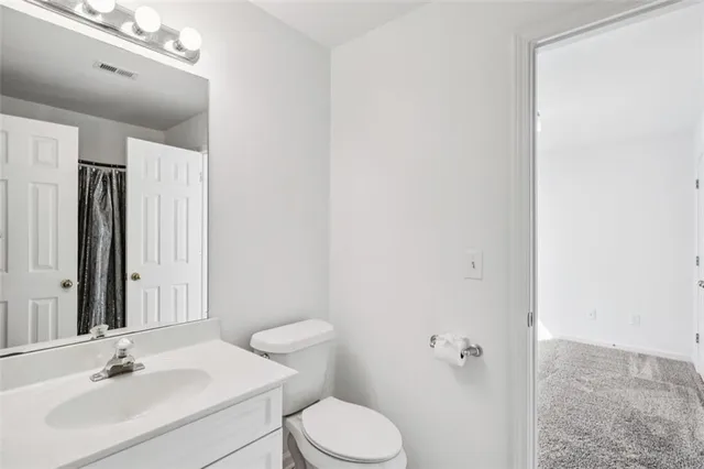 an empty room with a bathroom