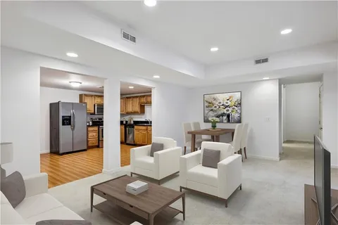 a bathroom with a sink toilet and mirror