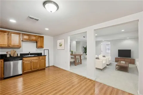 a view of a room with stairs and a chandelier fan