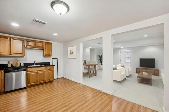 a view of a room with stairs and a chandelier fan