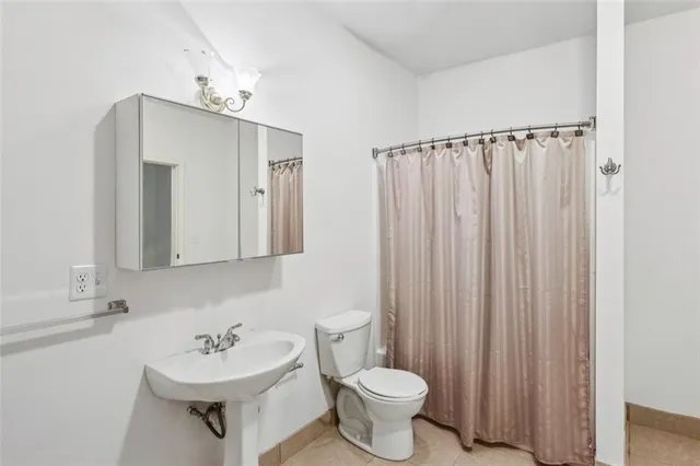 a view of a porch with wooden floor and fence